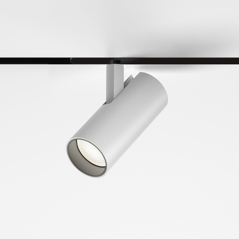 Faretto da binario magnetico Artemide Vector Magnetic bianco, corpo cilindrico su binario magnetico nero, testa LED orientabile