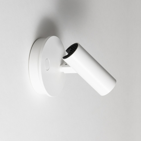 Artemide Vector Wall spotlight in white, adjustable cylindrical head with black interior, mounted on round wall base with touch dimmer