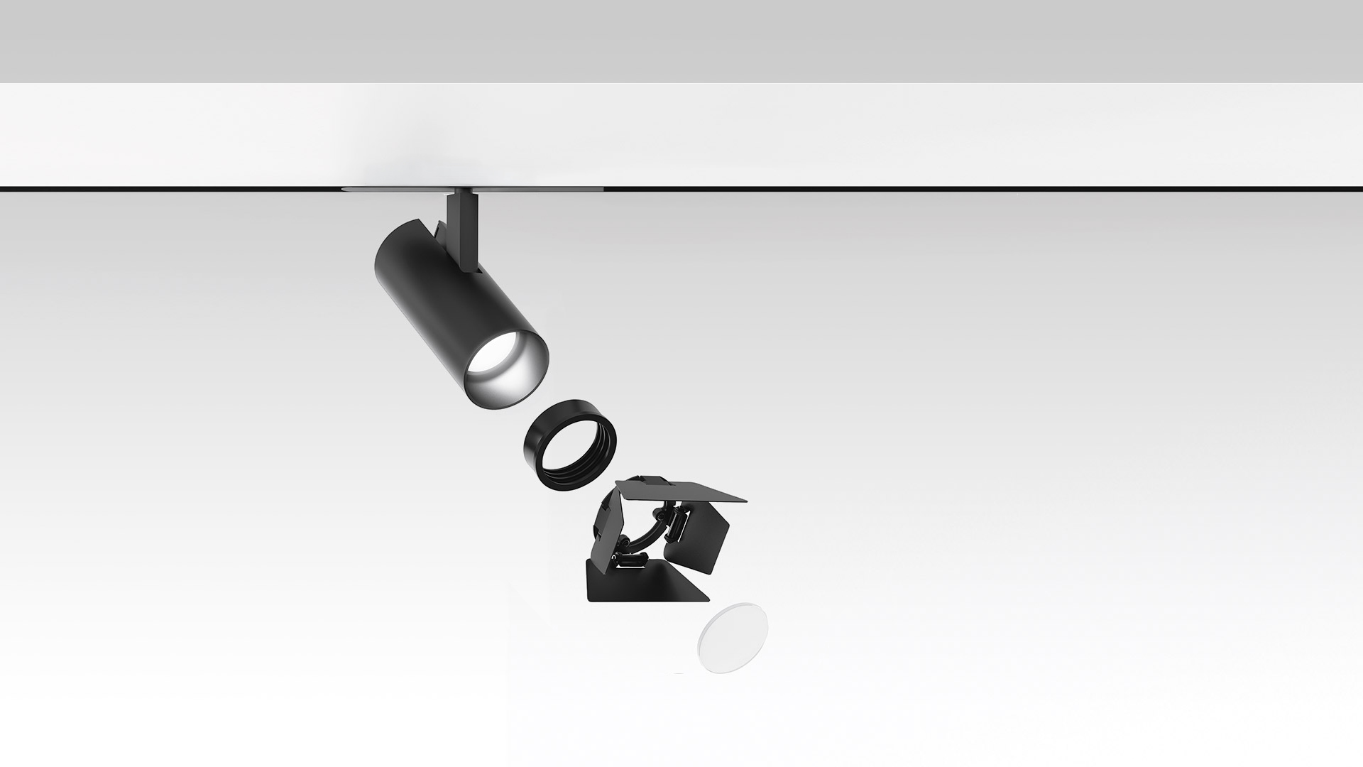 Faretti da binario Artemide Vector Magnetic in nero, mostrati con componenti modulari: versione cilindrica, con alette orientabili e da incasso su binario