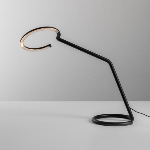 Artemide Vine Light table lamp: black angular arm with circular base, open ring-shaped LED light head in warm gold tone