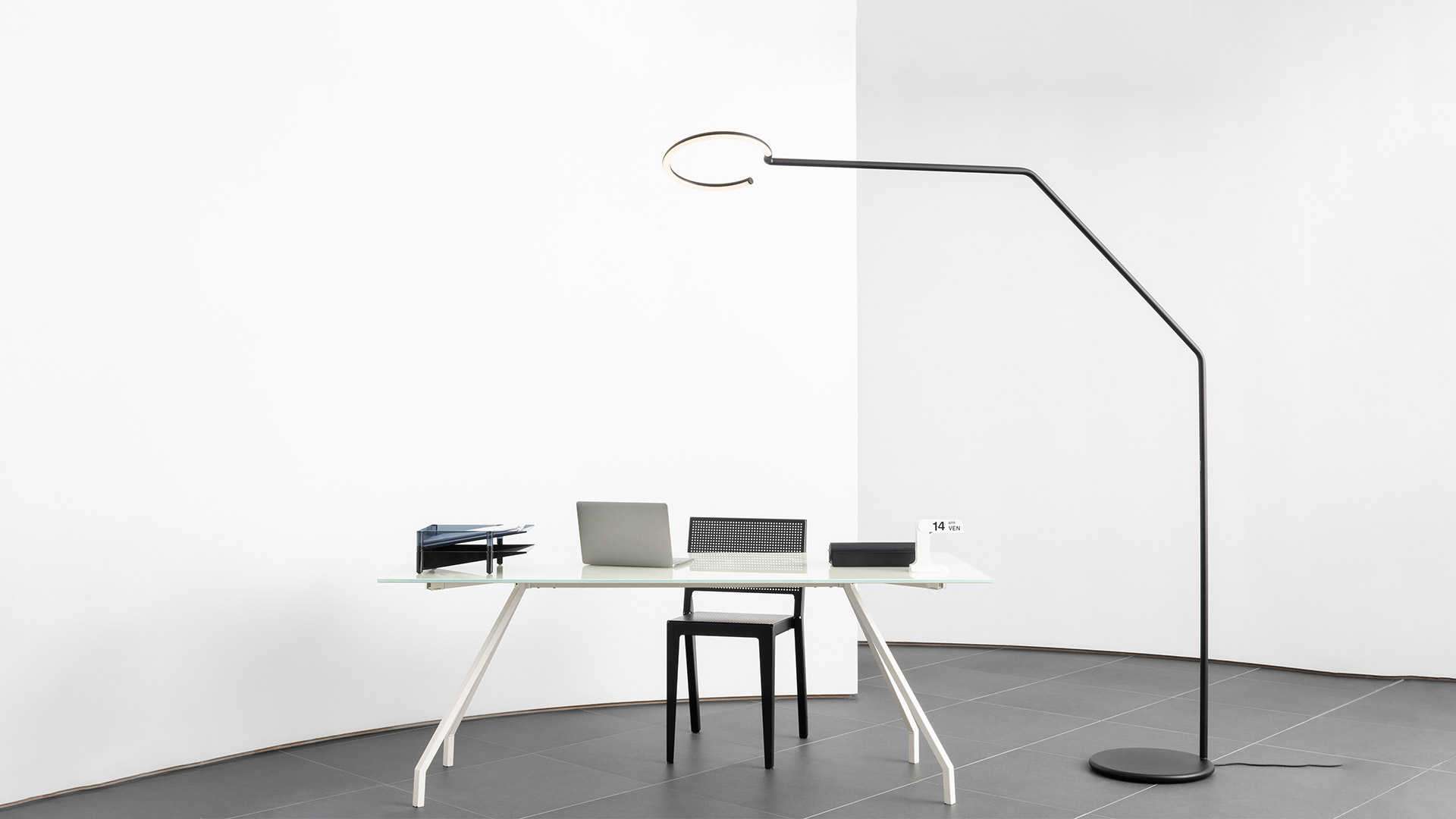 Artemide Vine Light: two black LED lamps with flexible curving stems, one floor-standing and one desk version, on white background
