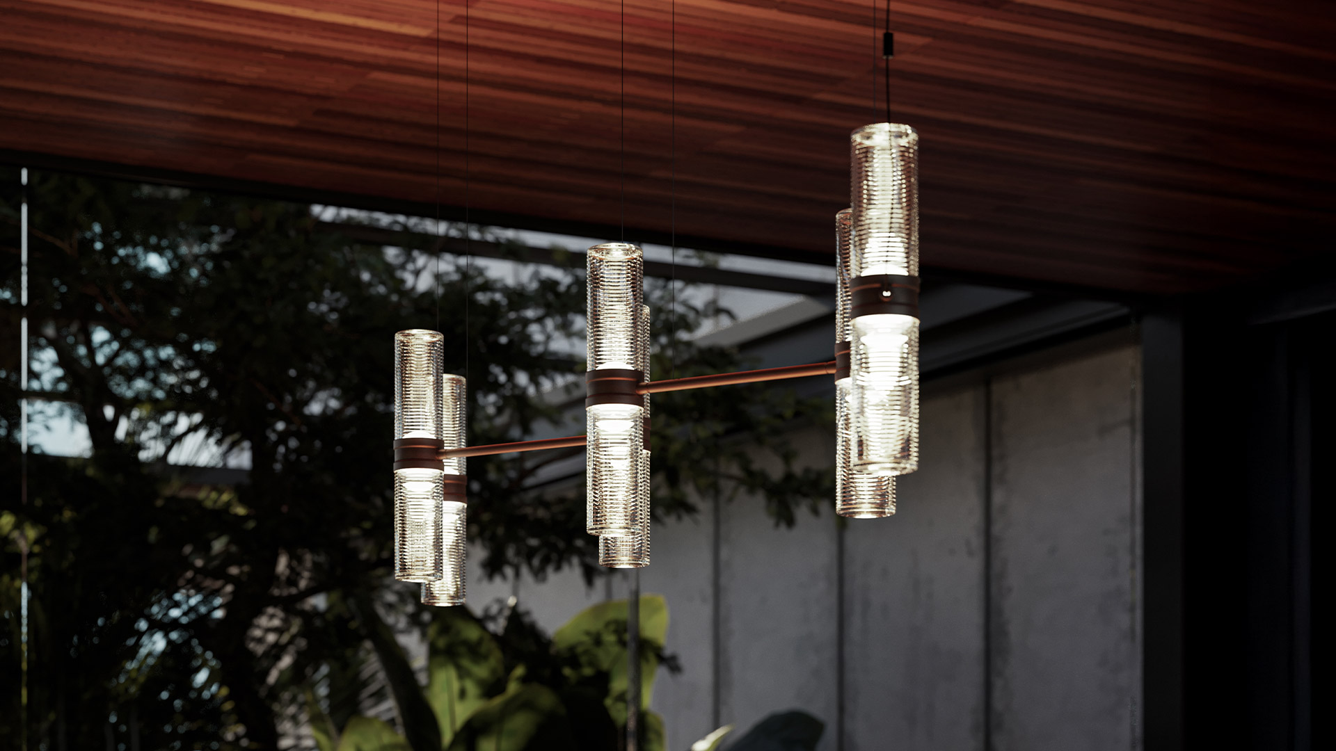 Lampada a sospensione Artemide Zephyr: struttura in metallo bronzo con cinque cilindri in vetro trasparente costolato a diverse altezze e angolazioni